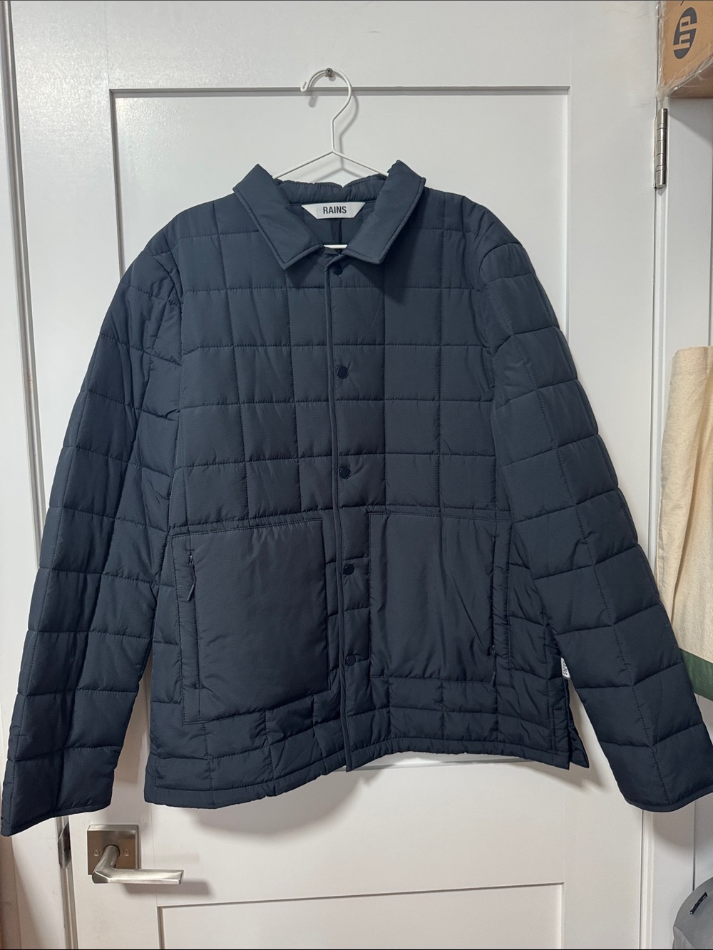 Rains Men's Quilted Puffer Jacket in Black